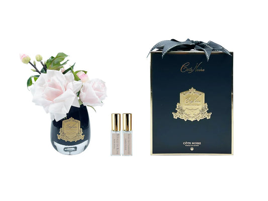 Rose de thé clair vase noir